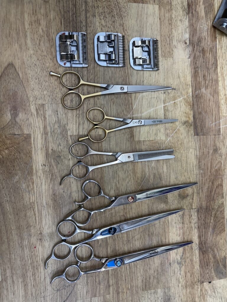 7 Stylist Shears and 3 clipper blades we Sharpened at our local shop.