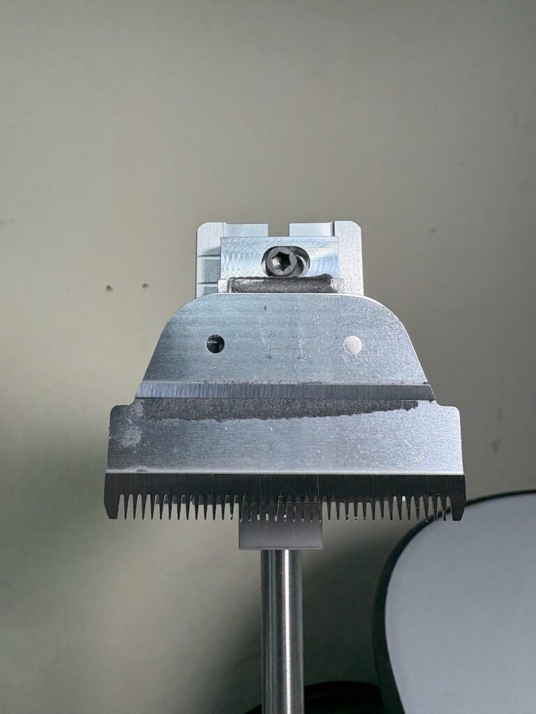 Clipper blade closeup sharpening